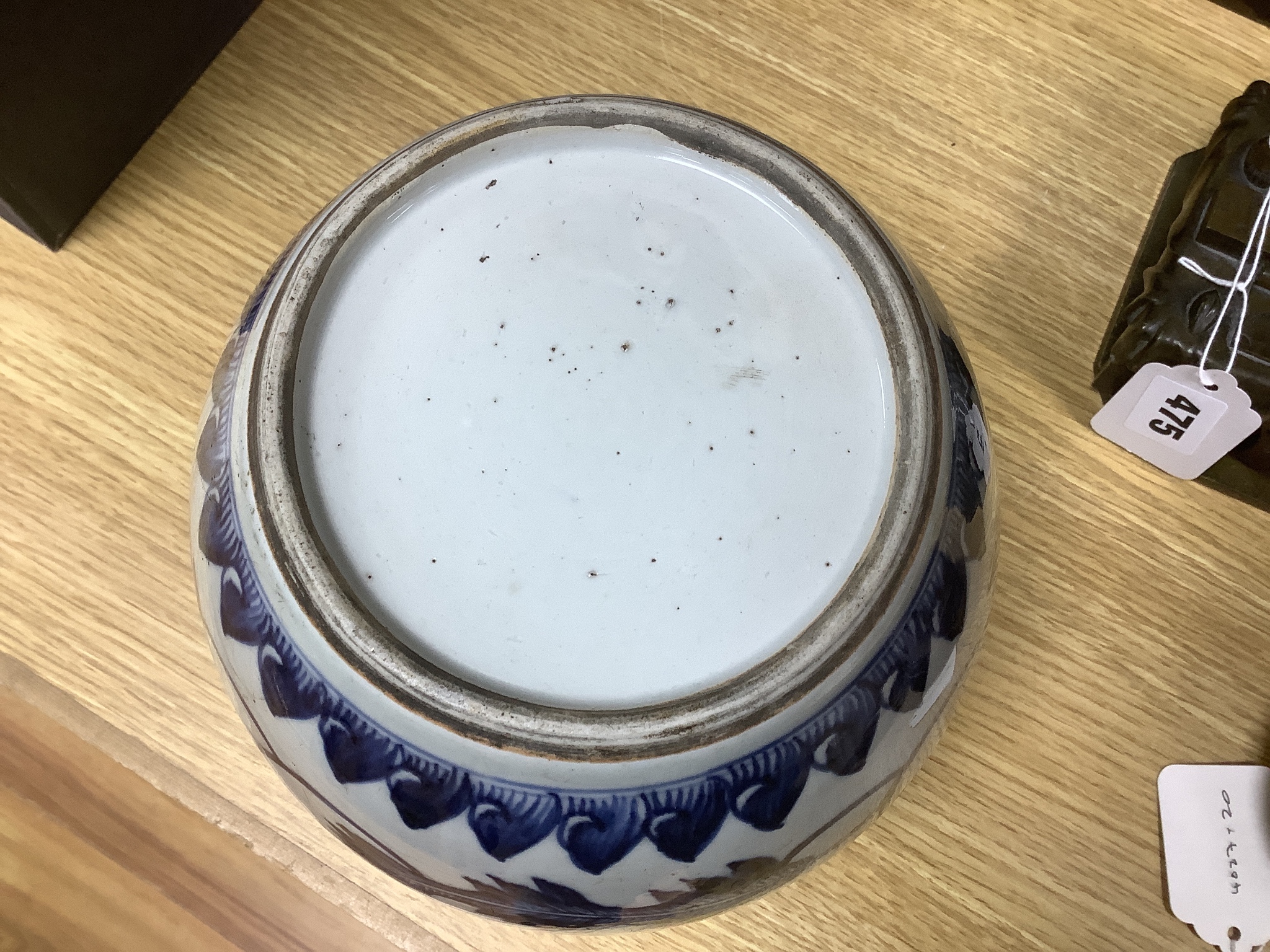 A 18th/19th century Chinese blue and white jar and wood cover - 22cm high